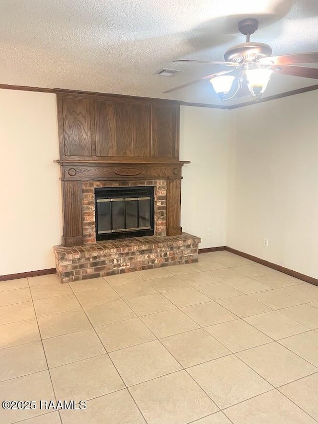 210 Essex St, Lafayette, LA 70506 - unfurnished living room with visible vents, light tile patterned flooring, baseboards, a brick fireplace, and ceiling fan