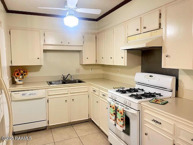 210 Essex St, Lafayette, LA 70506 - kitchen with under cabinet range hood, light countertops, white appliances, and a sink