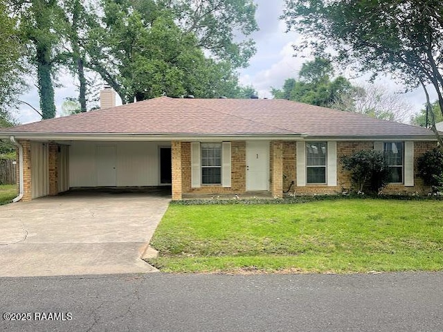 210 Essex St, Lafayette, LA 70506 - ranch-style home with a chimney, driveway, a carport, brick siding, and a front yard