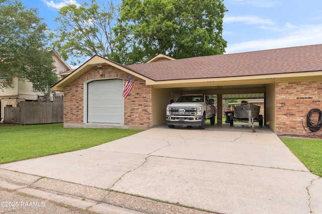 220 N Philo Dr, Lafayette, LA 70506 - view of front facade with a front lawn, brick siding, fence, and driveway