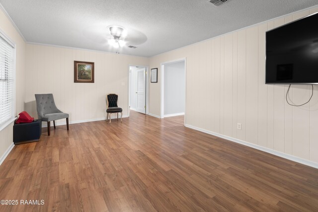220 N Philo Dr, Lafayette, LA 70506 - unfurnished room featuring wood finished floors, a textured ceiling, and baseboards
