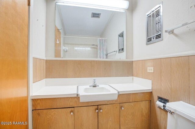 221 Beverly Dr, Lafayette, LA 70503 - full bathroom with a wainscoted wall, a shower with curtain, toilet, visible vents, and vanity