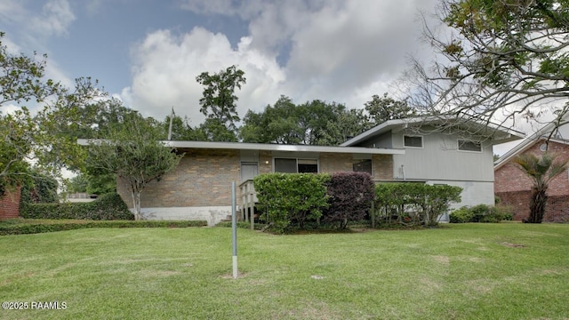 221 Beverly Dr, Lafayette, LA 70503 - tri-level home with brick siding and a front yard