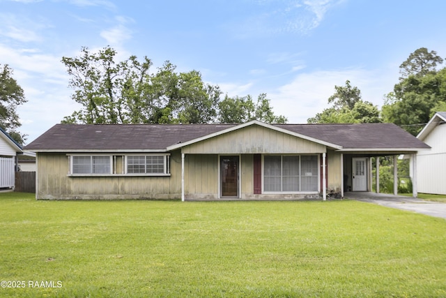 2318 Helen St, Abbeville, LA 70510 - ranch-style home featuring a carport, concrete driveway, and a front lawn