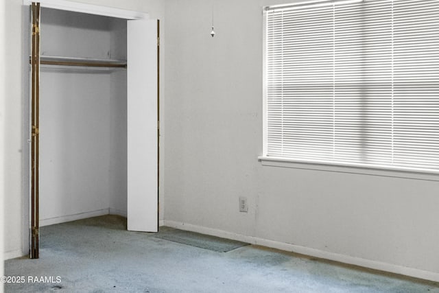 2318 Helen St, Abbeville, LA 70510 - unfurnished bedroom with carpet floors, baseboards, and a closet