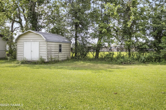 2318 Helen St, Abbeville, LA 70510 - view of yard featuring a storage unit and an outbuilding