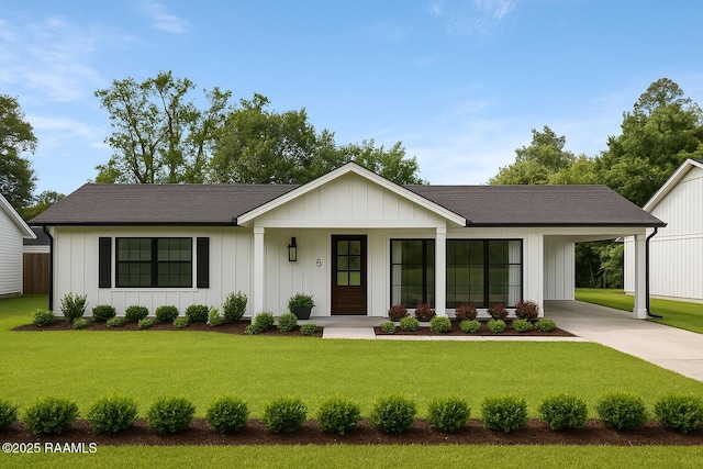 2318 Helen St, Abbeville, LA 70510 - view of front facade featuring a porch, driveway, a front yard, and an attached carport