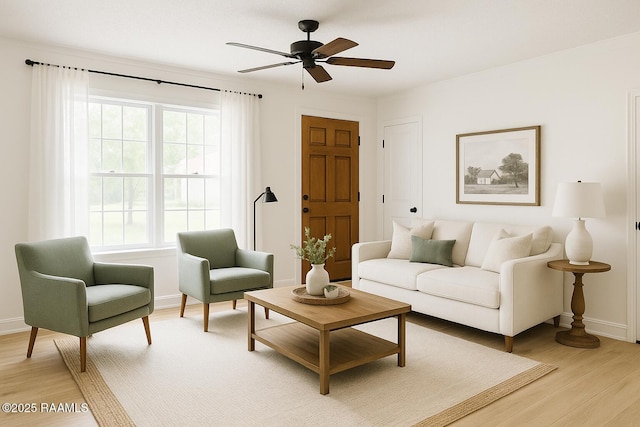 2318 Helen St, Abbeville, LA 70510 - living area with baseboards, light wood finished floors, and ceiling fan