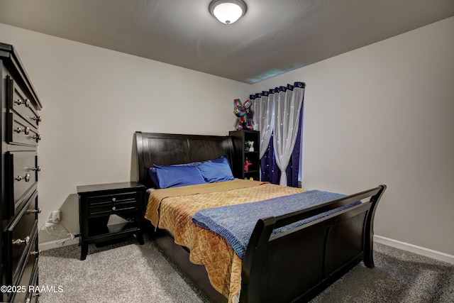 bedroom featuring baseboards and carpet flooring