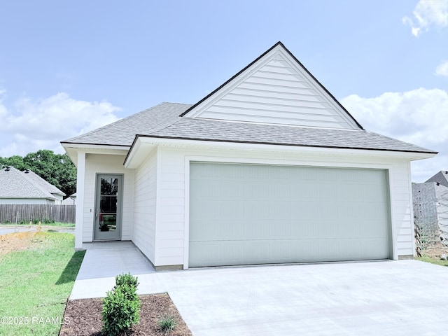 219 Berchman Oaks Dr, Lafayette, LA 70506 - view of front of property with roof with shingles, an attached garage, and concrete driveway