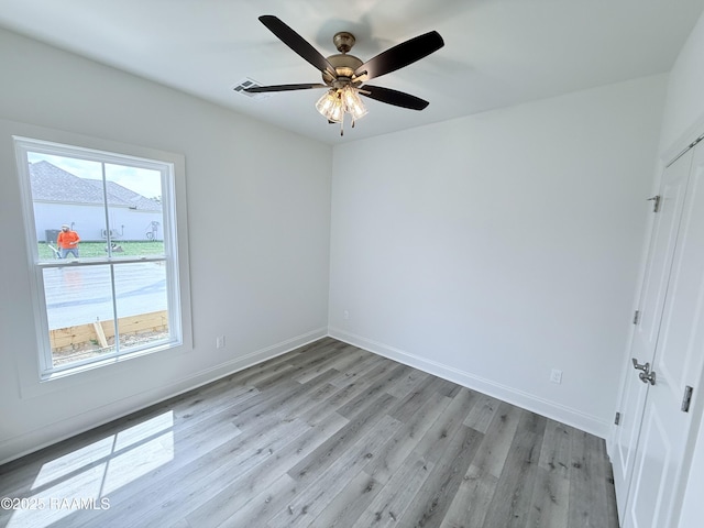 219 Berchman Oaks Dr, Lafayette, LA 70506 - empty room featuring light wood-type flooring, baseboards, and a ceiling fan