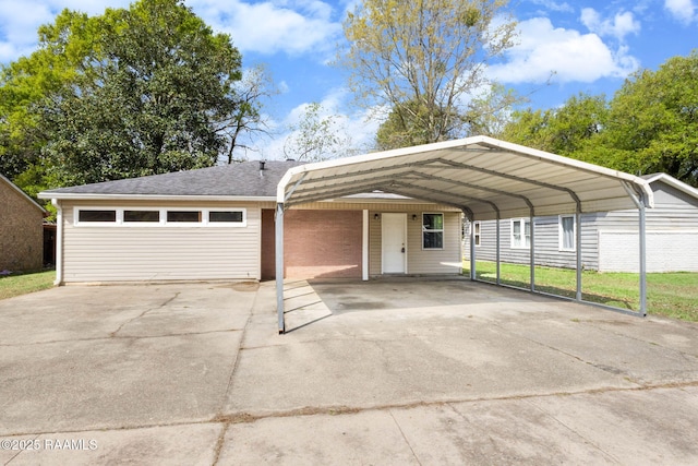 view of front of home featuring driveway, roof with shingles, and a detached carport