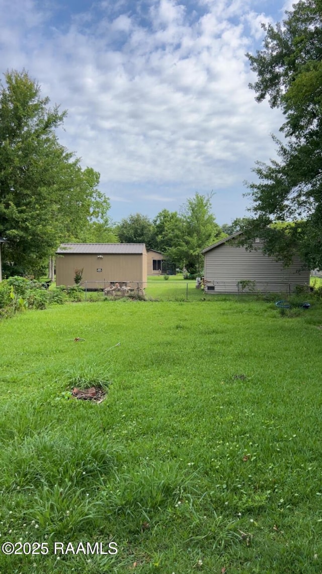 620 Boudreaux St, Franklin, LA 70538 - view of green lawn with an outbuilding