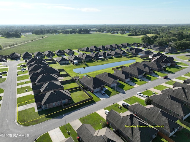 birds eye view of property featuring a water view and a residential view
