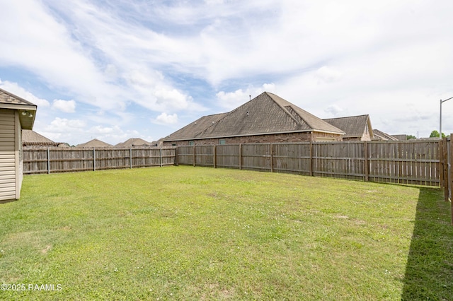 view of yard featuring a fenced backyard