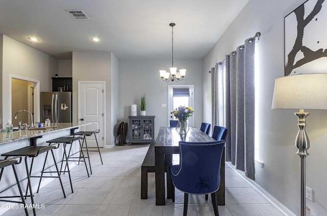 dining space featuring light tile patterned flooring, an inviting chandelier, recessed lighting, and visible vents