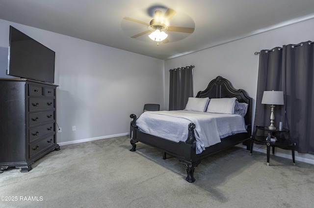 bedroom featuring baseboards, ceiling fan, and light carpet
