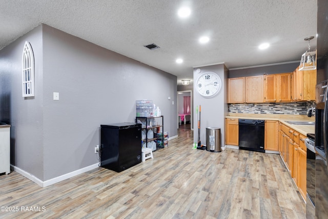 kitchen featuring light countertops, dishwasher, light wood-style floors, baseboards, and tasteful backsplash