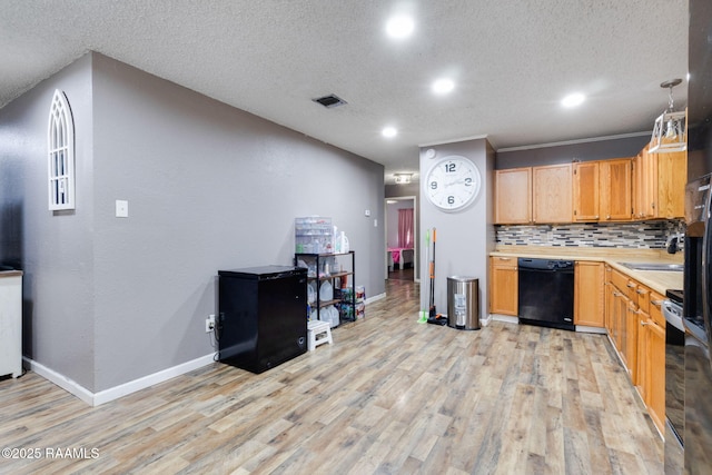 kitchen featuring light countertops, dishwasher, light wood finished floors, and baseboards