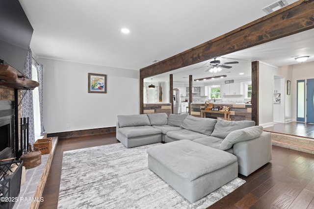 334 Meche Rd, Carencro, LA 70520 - living area featuring ceiling fan, baseboards, wood finished floors, recessed lighting, and a fireplace