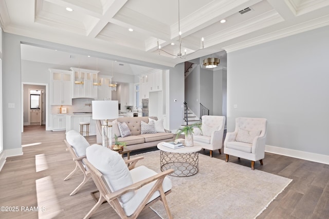 103 Arago Ct, Lafayette, LA 70508 - living room with coffered ceiling, stairway, a chandelier, a high ceiling, and beamed ceiling