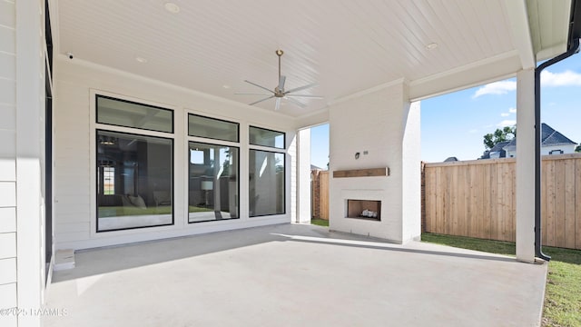 103 Arago Ct, Lafayette, LA 70508 - view of patio with a fireplace, fence, and ceiling fan