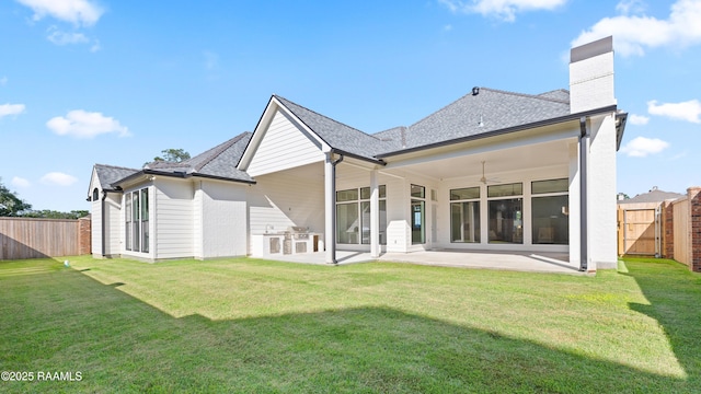 103 Arago Ct, Lafayette, LA 70508 - rear view of property featuring a patio, ceiling fan, a chimney, and a shingled roof