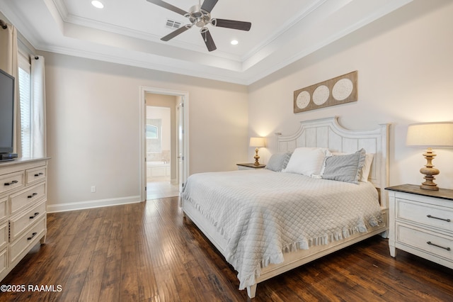 bedroom with dark wood finished floors, baseboards, crown molding, and a raised ceiling