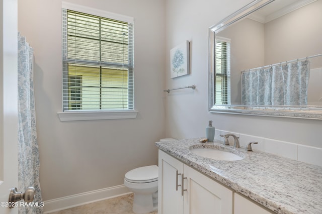 full bathroom featuring vanity, baseboards, toilet, ornamental molding, and tile patterned flooring