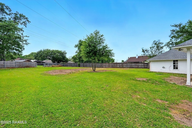 view of yard with a fenced backyard