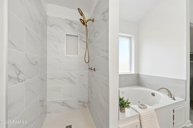 bathroom featuring a whirlpool tub and tiled shower