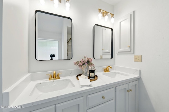 full bathroom with double vanity and a sink