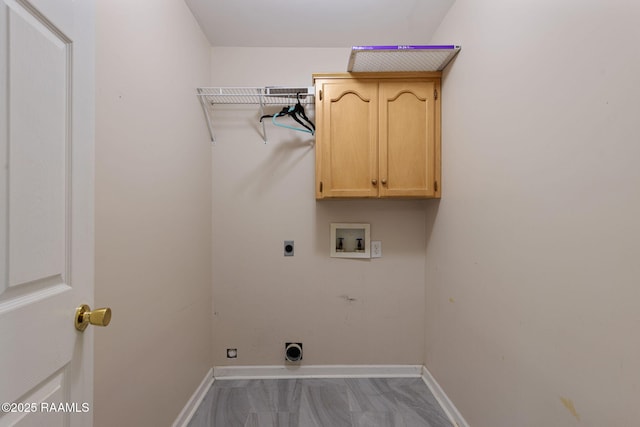 laundry room featuring electric dryer hookup, cabinet space, hookup for a washing machine, and baseboards