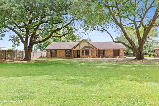 103 Failla Rd, Lafayette, LA 70508 - view of front of property featuring brick siding, a front lawn, and fence