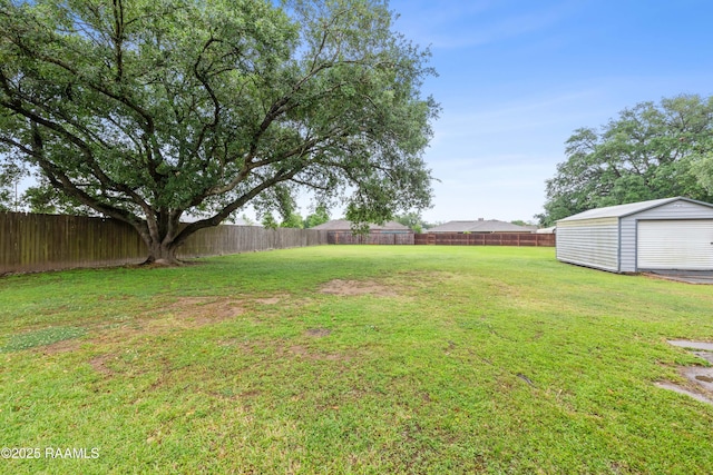 103 Failla Rd, Lafayette, LA 70508 - view of yard with a fenced backyard and an outbuilding