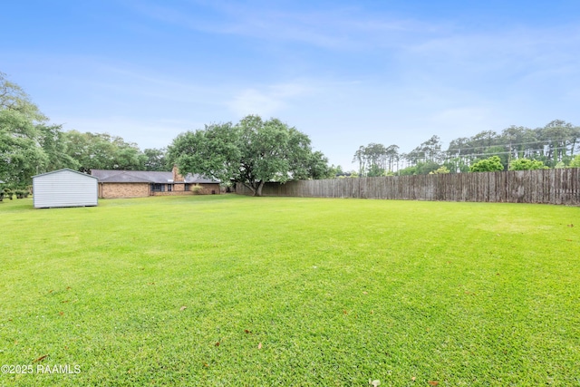 103 Failla Rd, Lafayette, LA 70508 - view of yard featuring fence, an outbuilding, and a shed