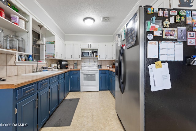 103 Failla Rd, Lafayette, LA 70508 - kitchen with blue cabinets, white cabinets, a sink, visible vents, and appliances with stainless steel finishes