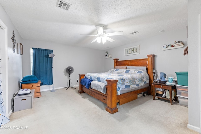 103 Failla Rd, Lafayette, LA 70508 - carpeted bedroom featuring a textured ceiling, visible vents, and ceiling fan