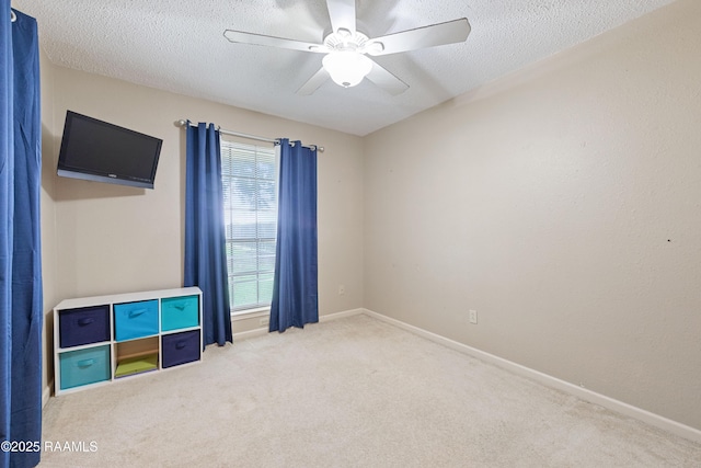 103 Failla Rd, Lafayette, LA 70508 - interior space featuring a textured ceiling, carpet flooring, baseboards, and ceiling fan