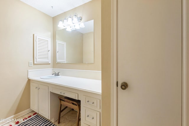103 Failla Rd, Lafayette, LA 70508 - bathroom with baseboards, vanity, and tile patterned flooring