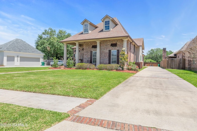 view of front of property featuring fence, a shingled roof, a front yard, and brick siding