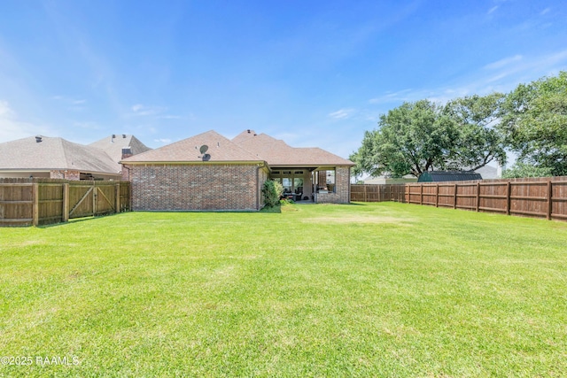 view of yard featuring a fenced backyard