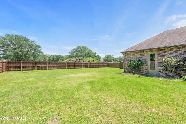view of yard featuring a fenced backyard