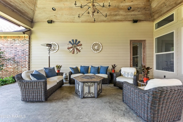 view of patio / terrace with an outdoor living space with a fire pit