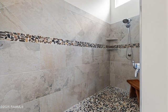 full bathroom with tiled shower