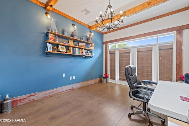 home office featuring a chandelier, baseboards, wood finished floors, beamed ceiling, and visible vents