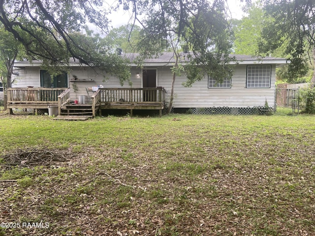 124 Brookside Dr, Lafayette, LA 70505 - rear view of house with a lawn, a wooden deck, and fence