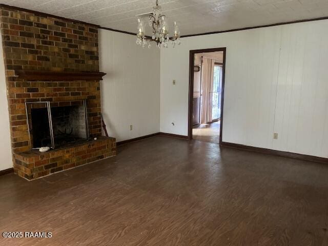 1614 Norway St, Opelousas, LA 70570 - unfurnished living room with wood finished floors, a chandelier, baseboards, and a fireplace