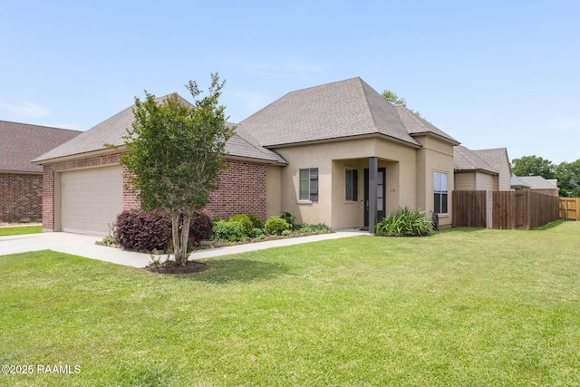 view of front of house featuring concrete driveway, an attached garage, fence, and a front yard