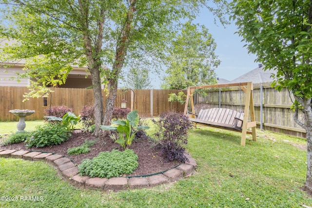 view of yard with a fenced backyard